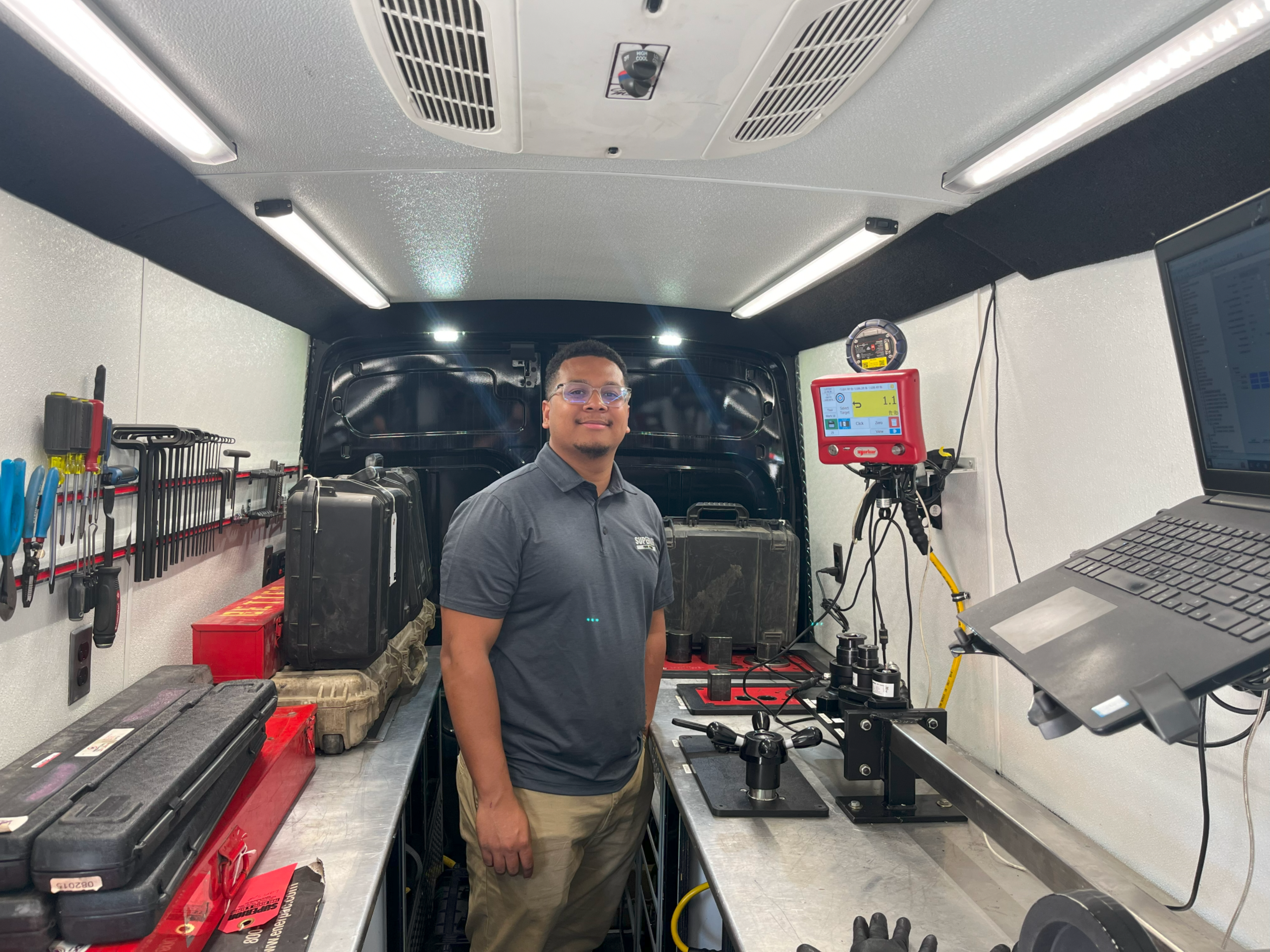 John Gibbs working inside the bolting van