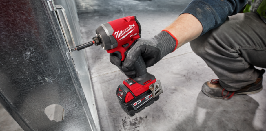 A picture of a Milwaukee impact driver being used to tighten a screw