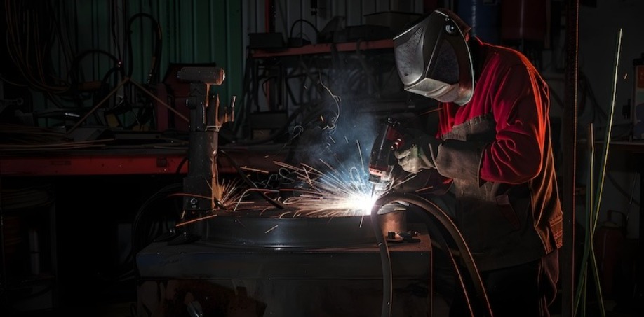 A person welding a piece of steel together